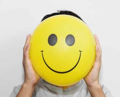 a,man,holding,yellow,balloon,with,smile,face,emotion,instead a,man,holding,yellow,balloon,with,smile,face,emotion,instead